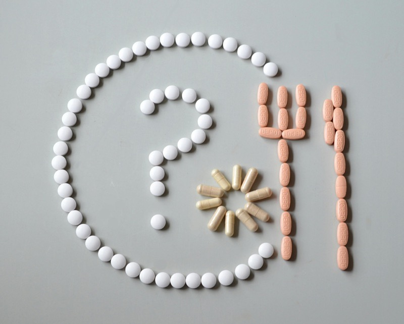 Medical professional examining thyroid treatment options, representing natural approaches to Hashimoto disease management
